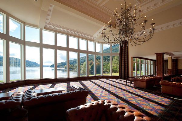 Impressive glass fronted foyer over looking Loch Long