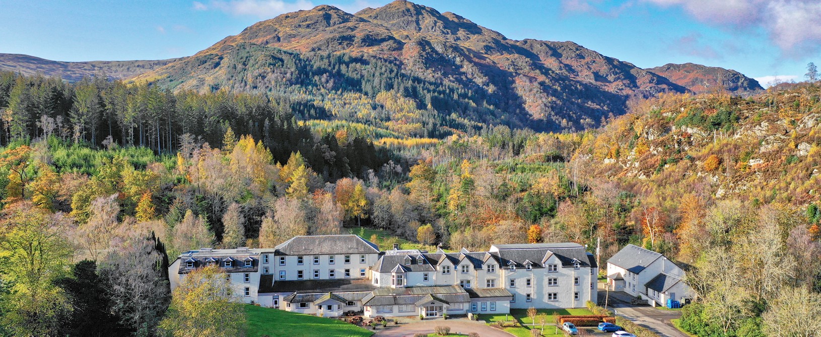 An autumn image of loch Achray Hotel